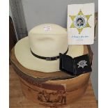 A Stetson hat in original box (box a.f.); a Sherriff's badge