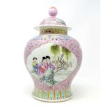 A Chinese famille rose ground baluster lidded vase with seal mark to base 32cm height