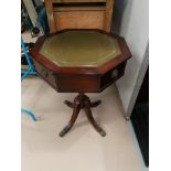 A reproduction octagonal shaped drum table