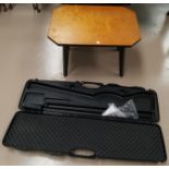 A modern gun carrying case; a coffee table