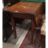 A Georgian mahogany dining table with oval drop leaf top, on turned legs and castors, 140 cm