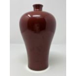A Chinese deep red plum shaped ceramic vase, ht 20cm