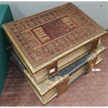 Two 19th century family Bibles, ornately brass bound and with tooled and gilded leather decoration