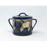 A Moorcroft 'Wisteria'double handled lidded pot signed 'WM' to base (lid damaged and partially