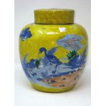 A Chinese yellow glaze lidded ginger jar with blue and white decoration of birds, double circle mark