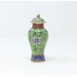 A Chinese famille vert small clobbered lidded vase, decorated with floral decoration height 11.5cm