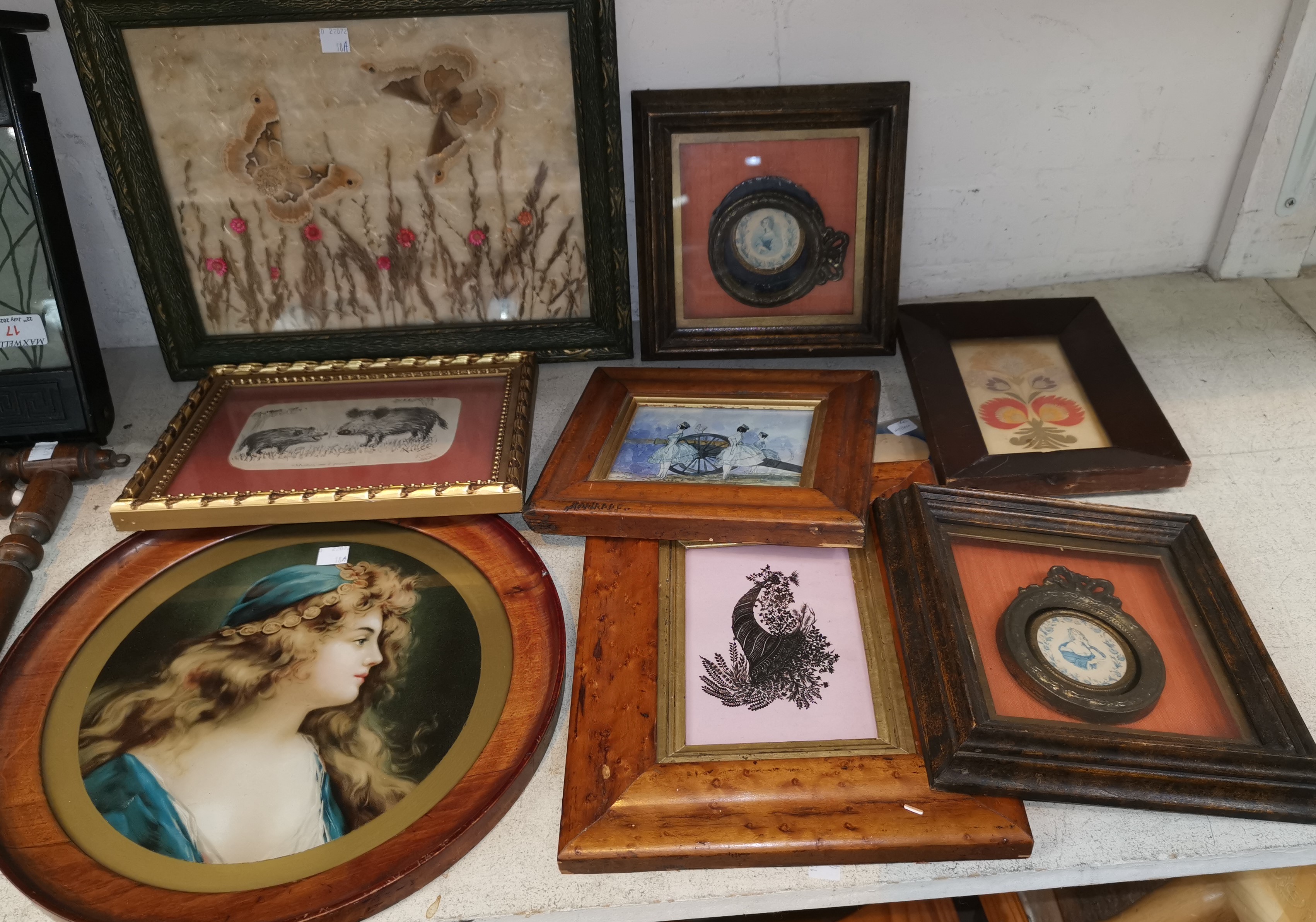 A framed collage of butterflies and flowers; a selection of miniature pictures and prints