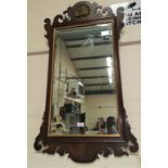 A Chippendale style wall mirror in parcel gilt and mahogany fretwork form height 104cm