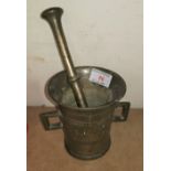 An antique bronze mortar and pestle