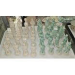 An early/mid 20th century Chinese chess set in green and white porcelain depicting oriental
