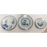 Three Chinese blue and white plates with floral decoration two measuring 23cm one 16cm