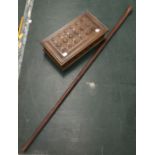 A hardwood walking stick; a carved wooden box