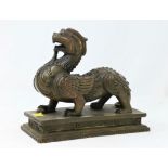A Chinese bronze sculpture of a mythical winged beast on a plinth length 17cm