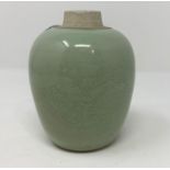 A Chinese ginger jar with celadon glaze and incised dragon decoration, 10 cm (no lid)