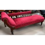 An Edwardian mahogany chaise longue with scroll end, in wine coloured dralon