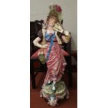 A late 19th century continental majolica figure of a young woman with a fan, 100 cm (restored)