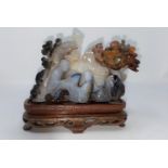 A Chinese agate coloured stone carving of 2 people playing a board game, on base (not matching)(some