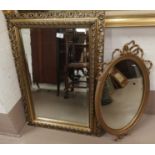 A mirror in rectangular gilt frame; an oval mirror in gilt frame