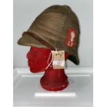 Lancashire Fusiliers, an early 20th century tropical pith helmet, red cloth badge and stand