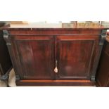 A 19th century rosewood side cabinet with square reeded acanthus carved side columns and 2