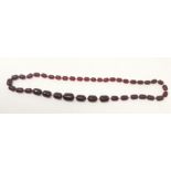 A cherry amber colour necklace with loose beads 44gm