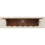 An oak reproduction coat rack/wall shelf in the French style, 130 cm