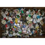 A large collection of various badges and buttons