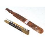 An oriental bamboo pipe with white metal mounts with lacquer and woven pipe case; a carved bamboo