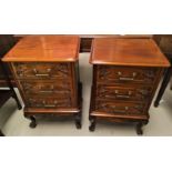 A mahogany pair of period style bedside tables, 3 height with carved drawers, on cabriole legs