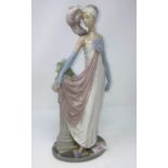 A Lladro figure of a woman in 1920's clothing, height 35 cm