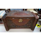A mid 20th century camphorwood chest with carved decoration