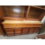 A mid 20th century teak sideboard by Nathan with 3 drawers and 2 cupboards, length 129 cm
