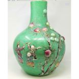 A Large 19th century Chinese bottle vase in the Cantonese manor with green ground and highly