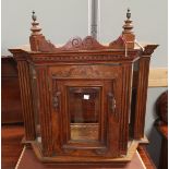 An Edwardian oak wall mounting display cabinet 58cm (AF)