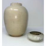 A Chinese white ground vase decorated with flowers, ht 22cm and a similar smaller bowl with 6