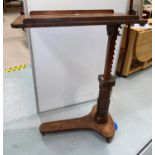 A 19th century mahogany bedside reading table with adjustable column