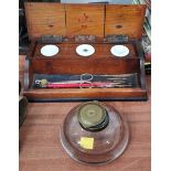 A desk inkwell, 3 sectional in wood; another in glass