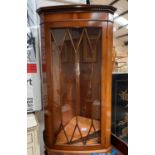 A reproduction yew wood wall hanging corner cupboard and nest of tables