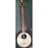 A late 19th/early 20th century 5 string banjo by F C Wilkes, with case