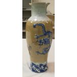 A large Chinese crackle glaze floor vase decorated with a dragon and tiger in relief, seal mark to