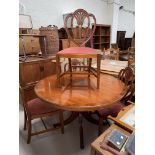 A set of 4 reproduction shield back dining chairs with carved splats and pink seats