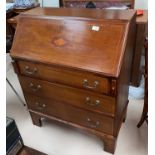 An inlaid mahogany bureau in the Sheraton style, with fall front and 3 drawers below