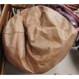 A brown leather bean bag