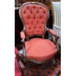 A Victorian mahogany framed spoon back armchair with knurled arms and legs, deeply buttoned in
