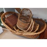 A wicker crib and other basketware; a Lloyd Loom linen box
