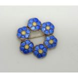 A Volmer Bahner Danish sterling silver brooch enamel blue and yellow flowers in circle