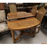 A dining suite, American/English oak with Colonial style parquetry work, comprising table with