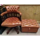 A swivel armchair and stool in button tan hide