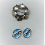 A pair of double leaf clip-on earrings in gilded sterling silver and turquoise enamel by David
