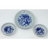 A Chinese blue and white bowl decorated with central dragon, 6 character mark to base, 17cm; a